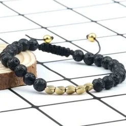 Niazy sort perlearmbånd / Lava golden